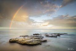 Fine art photograph of a rainbow seascape, Batts Rock, Barbados by Andre Donawa