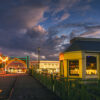 Fine art photograph of a sunset, Chamberlain Swing Bridge, Barbados by Andre Donawa.