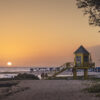 Fine art photograph of a sunset by the beach, Barbados by Andre Donawa.