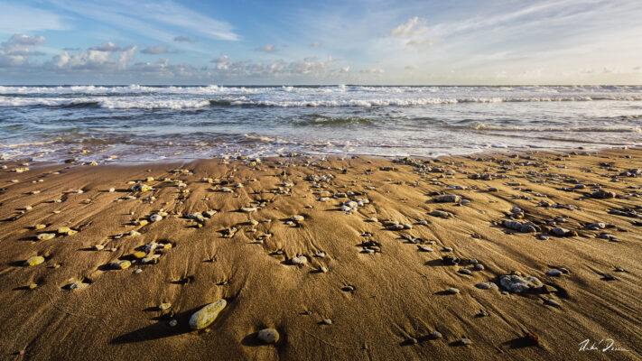 Fine art photograph of small rocks on the beach, Bathsheba, Barbados by Andre Donawa.