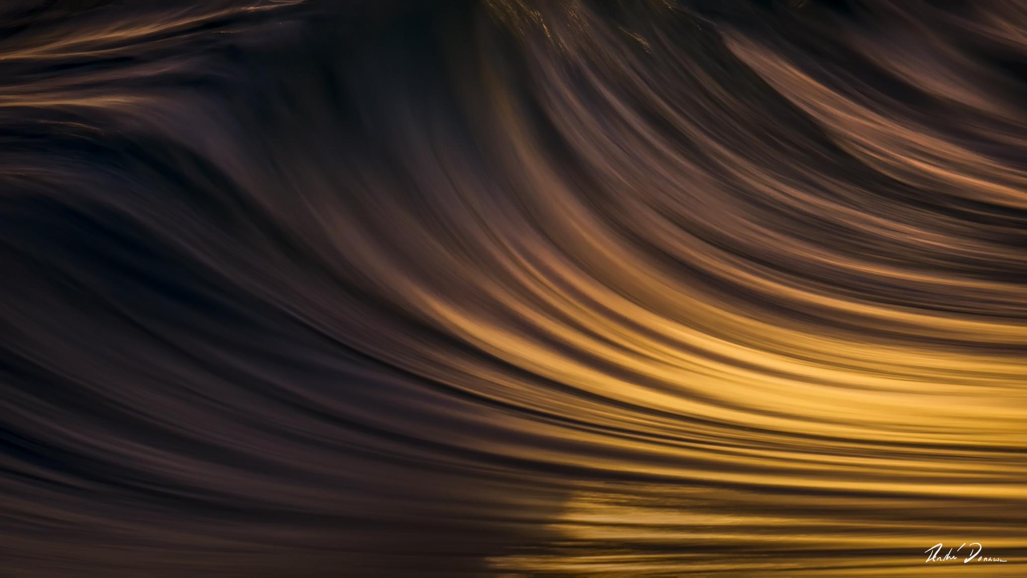 Abstract seascape created with Intentional Camera Movement photography during golden hour, featuring horizontal wave lines and a blurred ocean horizon