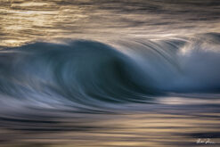 Abstract seascape created with Intentional Camera Movement photography during golden hour, featuring horizontal wave lines and a blurred ocean horizon